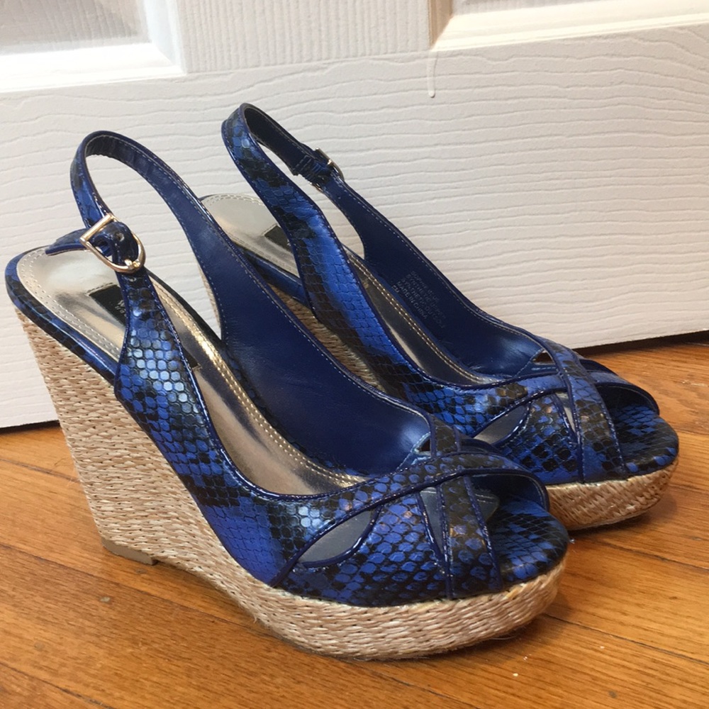 Blue wedges with snake skin pattern.